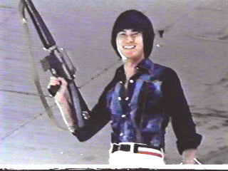 ALAN TANG WITH GUN