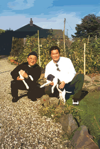 Alan Tang with puppies