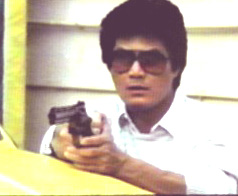 ALAN TANG WITH GUN